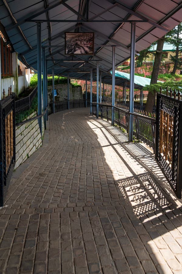 Covered walkway at Shimla Old Railway station. Shimla railway station is a small railway station in Shimla in the Indian state of Himachal Pradesh. The station is the terminus of the UNESCO World Heritage Site Kalka–Shimla Railway. Shimla railway station is located at an altitude of 2,075 metres (6,808 ft) above mean sea level. It was allotted the railway code of SML under the jurisdiction of Ambala railway division. The 762 mm (2 ft 6 in)-wide narrow-gauge Kalka-Shimla Railway was constructed by Delhi–Ambala–Kalka Railway Company and opened for traffic in 1903. Code division stock images, royalty-free photos and pictures