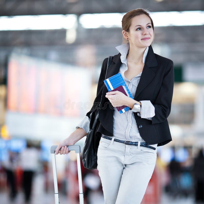 Pretty young female passenger at the airport (shallow DOF; color toned image). Pretty young female passenger at the airport (shallow DOF; color toned image)