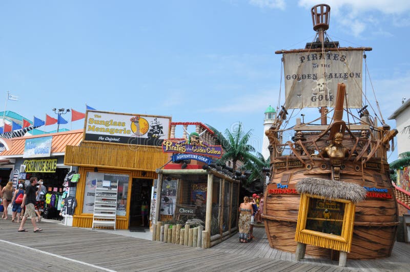 OCEAN CITY, NEW JERSEY - SEPTEMBER 1: Ocean City Boardwalk in New Jersey, as seen on September 1, 2013. The boardwalk is 2.5 miles long and one of the most well-known boardwalks in the world. OCEAN CITY, NEW JERSEY - SEPTEMBER 1: Ocean City Boardwalk in New Jersey, as seen on September 1, 2013. The boardwalk is 2.5 miles long and one of the most well-known boardwalks in the world.