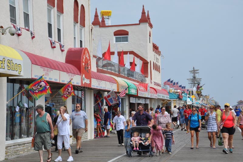 OCEAN CITY, NEW JERSEY - SEPTEMBER 1: Ocean City Boardwalk in New Jersey, as seen on September 1, 2013. The boardwalk is 2.5 miles long and one of the most well-known boardwalks in the world. OCEAN CITY, NEW JERSEY - SEPTEMBER 1: Ocean City Boardwalk in New Jersey, as seen on September 1, 2013. The boardwalk is 2.5 miles long and one of the most well-known boardwalks in the world.