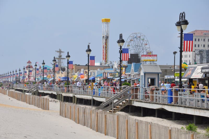 OCEAN CITY, NEW JERSEY - SEPTEMBER 1: Ocean City Boardwalk in New Jersey, as seen on September 1, 2013. The boardwalk is 2.5 miles long and one of the most well-known boardwalks in the world. OCEAN CITY, NEW JERSEY - SEPTEMBER 1: Ocean City Boardwalk in New Jersey, as seen on September 1, 2013. The boardwalk is 2.5 miles long and one of the most well-known boardwalks in the world.