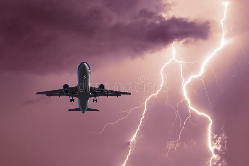 Passenger Airplane Landing in the Stormy Weather on the Backdrop ...