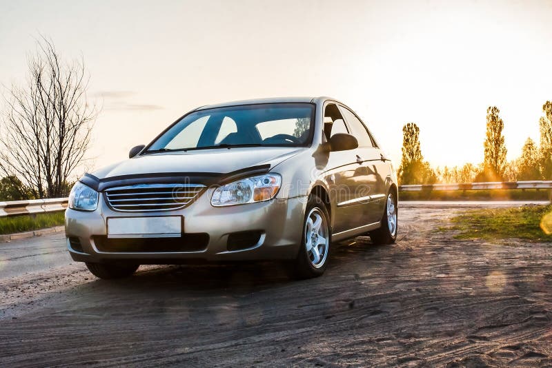 Passenger car sedan on the road in the sunlight, close-up royalty free stock photos Passenger car sedan on the road in the sunlight, close-up royalty free stock photos