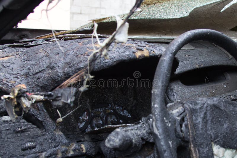 passenger compartment after the fire, partially burned down parts of the car stock photo passenger compartment after the fire, partially burned down parts of the car stock photo