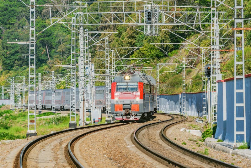 Passenger double deck train moves along the mountains. Sochi stock image Passenger double deck train moves along the mountains. Sochi stock image