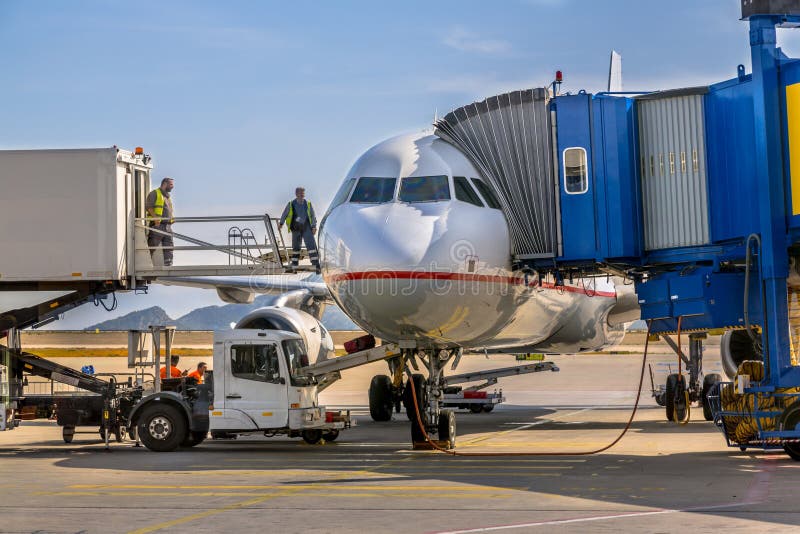 Passenger jet airplane docked at gate