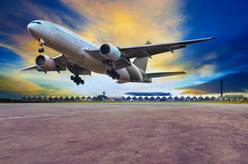 passenger jet plane landing on air port runways against beautiful dusky sky use for travel business and air transport royalty free stock images passenger jet plane landing on air port runways against beautiful dusky sky use for travel business and air transport royalty free stock images