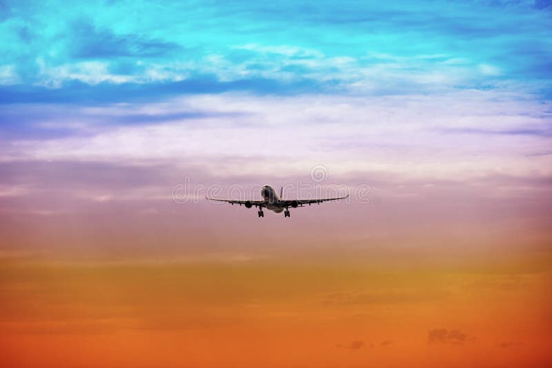 Passenger plane takes off at sunset royalty free stock photos