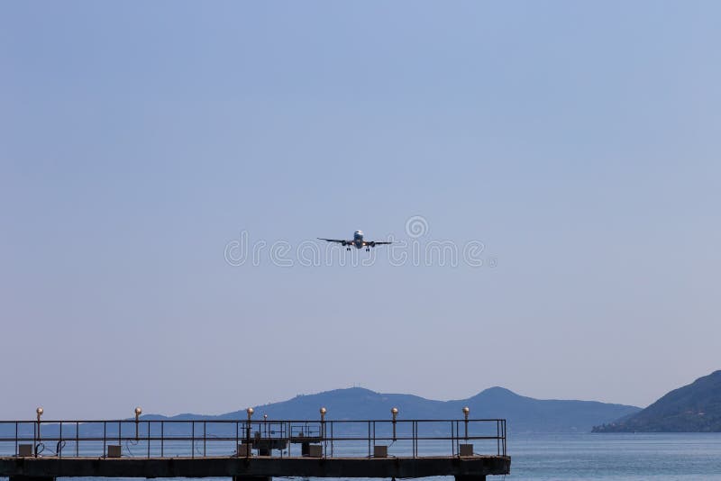 Passenger`s airplane is landing. Decrease in height. Greece, Corfu. Airplane height stock images, royalty-free photos and pictures