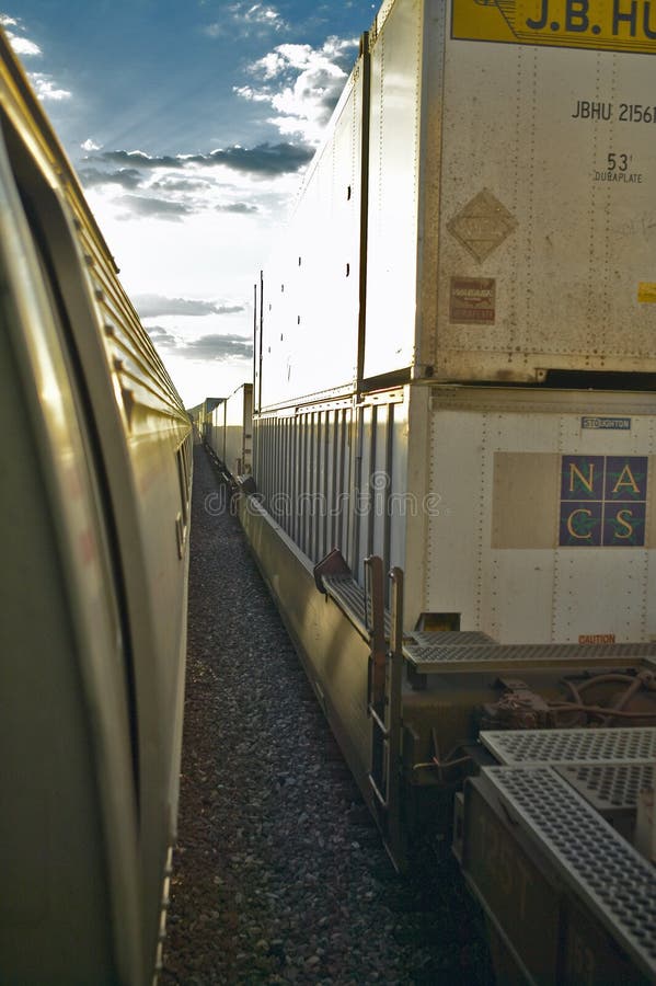 Passenger Train Traveling into the Arizona Sunset Editorial Photography