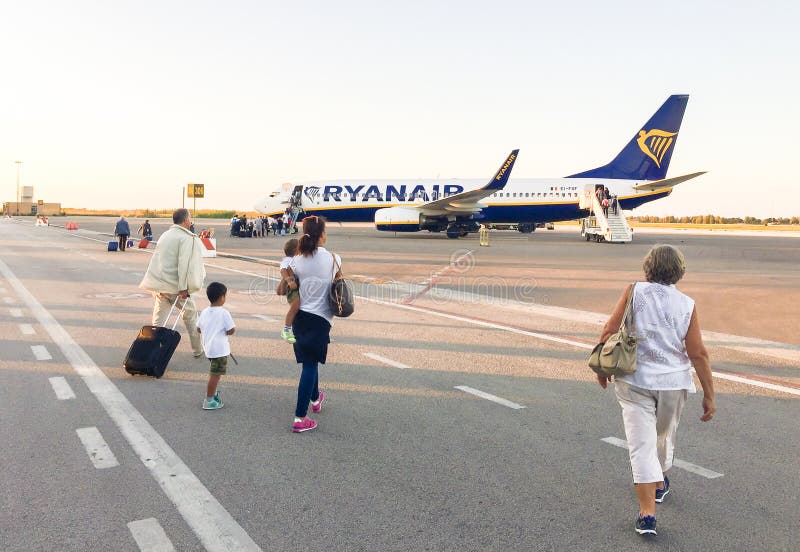 Passengers Boarding Ryanair Jet Airplane in Trapani Airport. Editorial