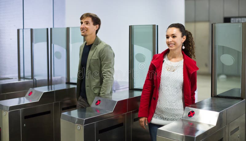 Passengers passing the turnstile stock photography Passengers passing the turnstile stock photography