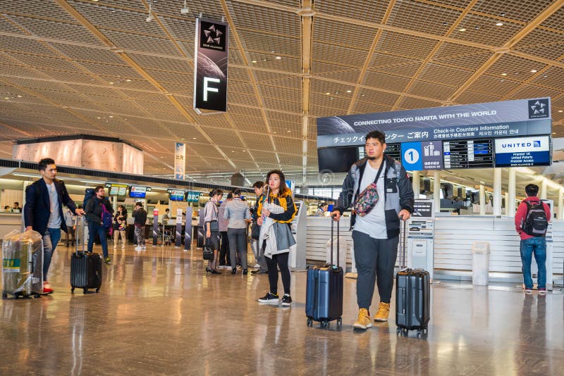 Passengers walk around at terminal 1 departure area at Narita International Airport, Tokyo, Japan stock image Passengers walk around at terminal 1 departure area at Narita International Airport, Tokyo, Japan stock image