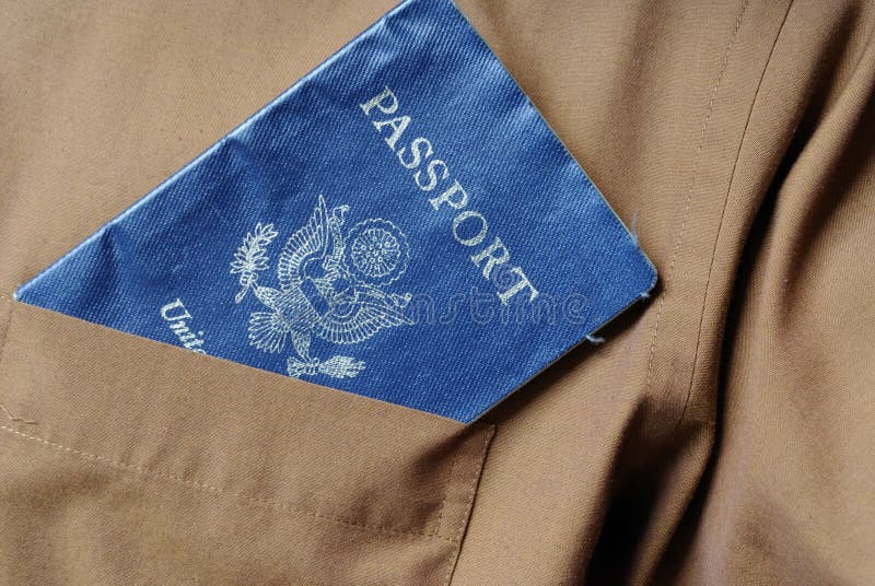 Passport sticking out of a pocket of a brown shirt. Passport sticking out of a pocket of a brown shirt.