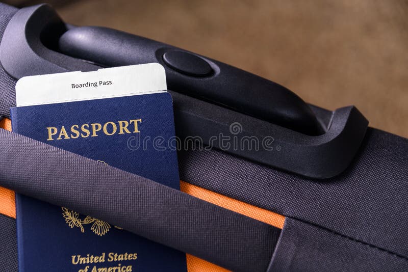 US passport and a boarding pass, suitcase. US passport and a boarding pass, suitcase