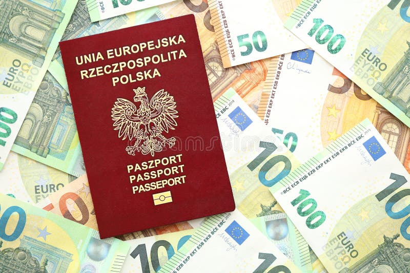 Red polish passport and big amount of european euro money bills close up. Red polish passport and big amount of european euro money bills close up