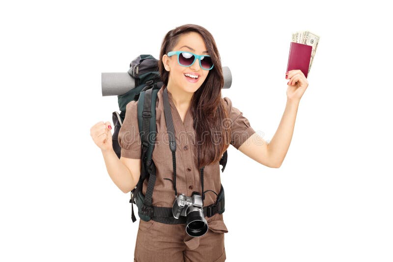 Happy female tourist holding passport with money isolated on white background. Happy female tourist holding passport with money isolated on white background