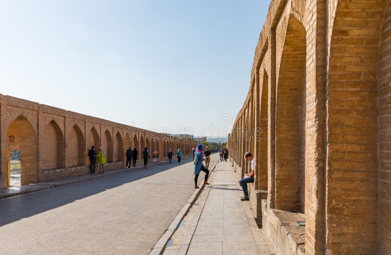 Isfahan, Iran - November 2, 2019: Walkway and arch walls of Si-o-Se Pol (Bridge of 33 Arches or Allahverdi Khan Bridge) on Zayanderud in Isfahan, Iran. Architectural masterpiece and heritage. Isfahan, Iran - November 2, 2019: Walkway and arch walls of Si-o-Se Pol (Bridge of 33 Arches or Allahverdi Khan Bridge) on Zayanderud in Isfahan, Iran. Architectural masterpiece and heritage.