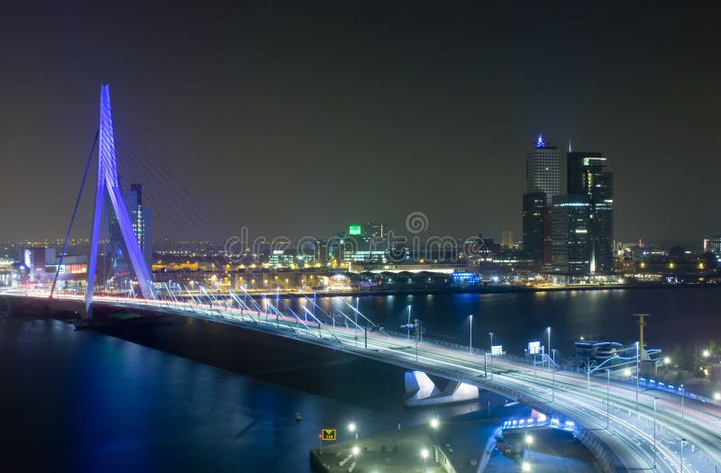 The Rotterdam Skyline with the famous Erasmus Bridge over the river Meuze at night. The Rotterdam Skyline with the famous Erasmus Bridge over the river Meuze at night