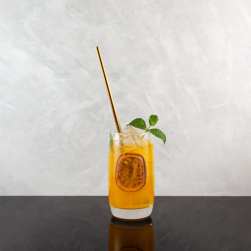 Passion Fruit Carbonated Drink with Ice and Mint. Refreshing Summer