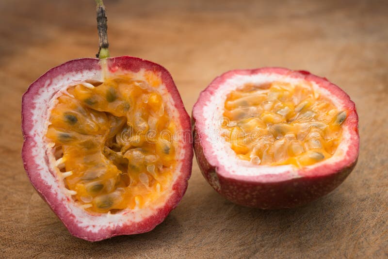 Passion fruit cut out on wooden background