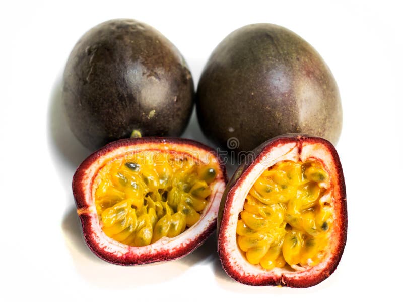 Passion fruit Passiflora edulis.3 fruits. The fruit is cut in two halves. Isolated on a white background stock photos Passion fruit Passiflora edulis.3 fruits. The fruit is cut in two halves. Isolated on a white background stock photos