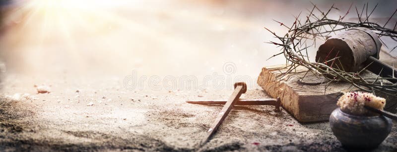 Passion Of Jesus Christ - Hammer And Bloody Nails. And Crown Of Thorns On Arid Ground With Defocused Background