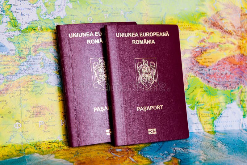 Passport on map. Travel to Europe Preparation for Traveling concept. An official passport of Romania stock photos Passport on map. Travel to Europe Preparation for Traveling concept. An official passport of Romania stock photos