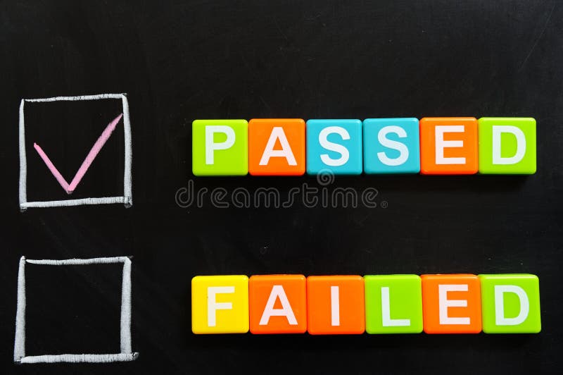 Passed or failed words made of blocks on blackboard. Passed or failed words made of blocks on blackboard