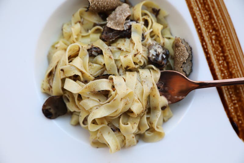 pasta with black truffles on a plate , Italian food. pasta with black truffles on a plate , Italian food