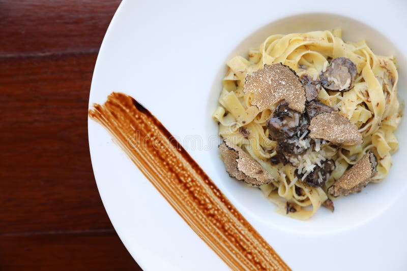 pasta with black truffles on a plate. pasta with black truffles on a plate