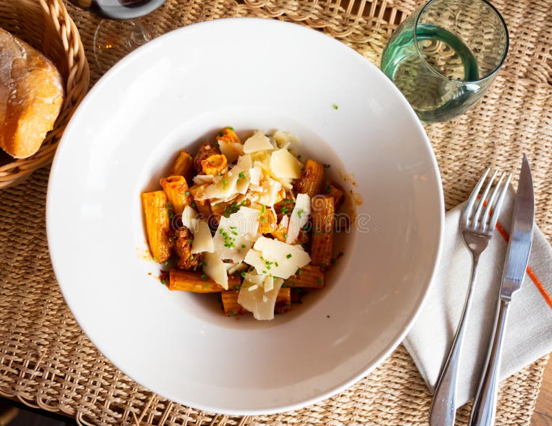 Pasta bolognese with cheese served on platter stock image