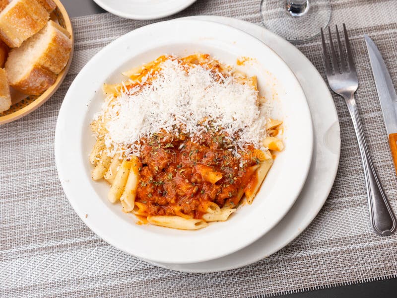 Pasta bolognese with cheese served on platter royalty free stock image