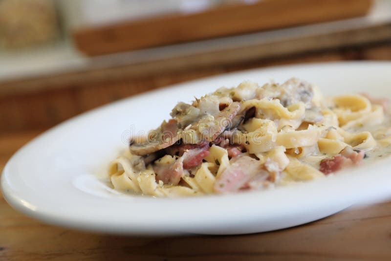 Pasta Fettuccine Alfredo White Sauce with Ham Bacon and Mushroom Stock