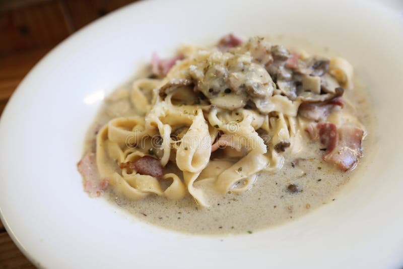 Pasta Fettuccine Alfredo White Sauce with Ham Bacon and Mushroom Stock