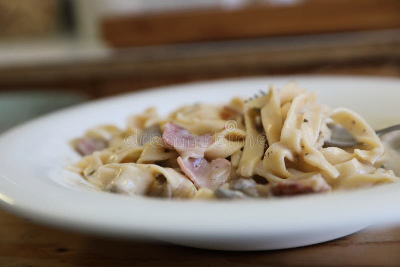 Pasta Fettuccine Alfredo White Sauce with Ham Bacon and Mushroom Stock