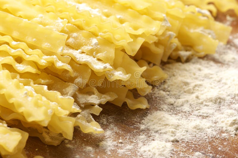 Pasta in flour stock photo. Image of cuisine, mafaldi 13244758