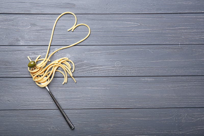 Pasta on Fork with Olive on Wooden Background Stock Photo Image of