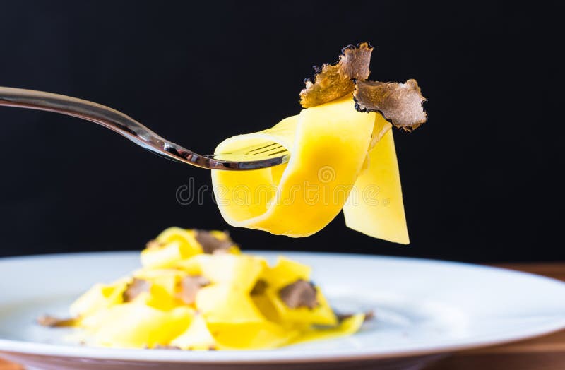 Pasta on fork with truffles