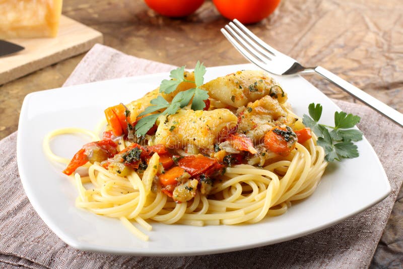 Pasta with fresh grouper fillet royalty free stock images