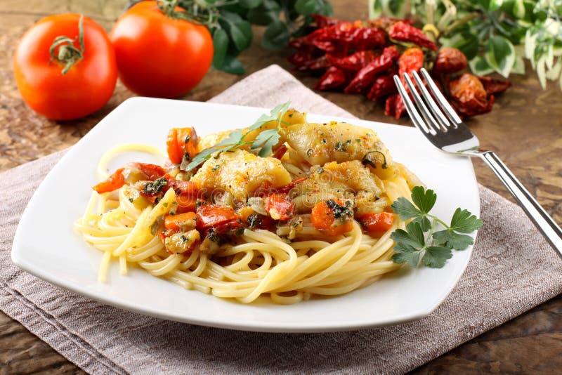 Pasta with fresh grouper fillet stock photos