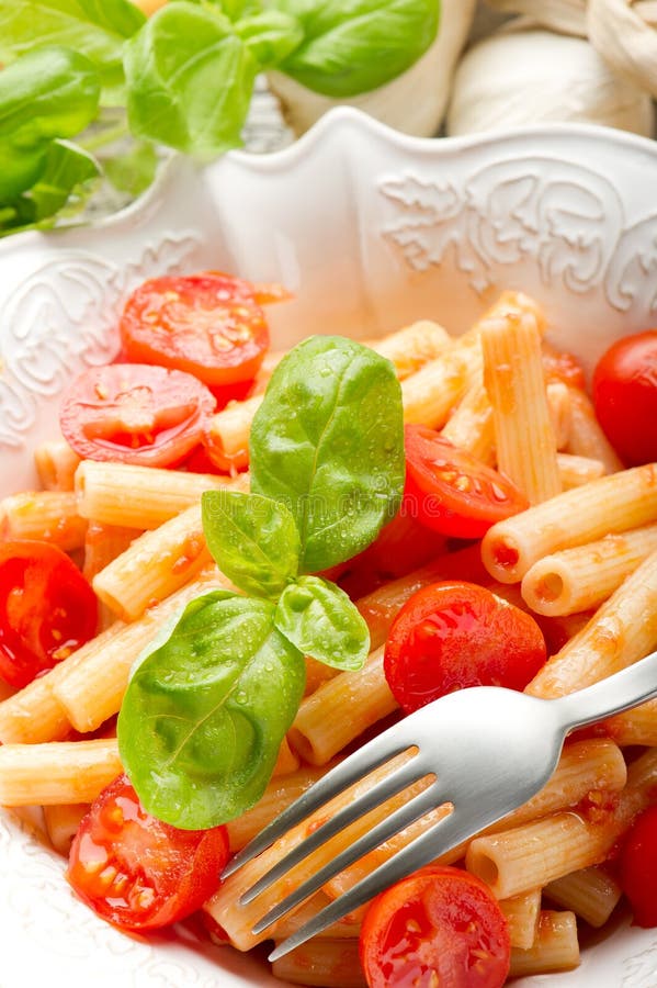 Pasta with fresh tomatoes stock photo