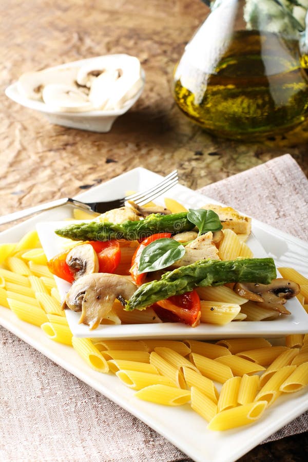 Pasta with fresh tuna, mushrooms and asparagus stock photography