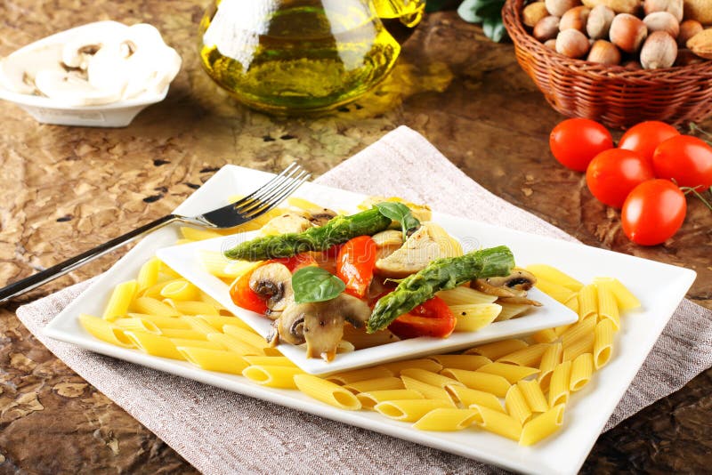 Pasta with fresh tuna, mushrooms and asparagus stock photography