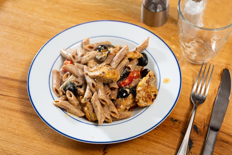 Pasta with fried chicken and vegetables royalty free stock photos