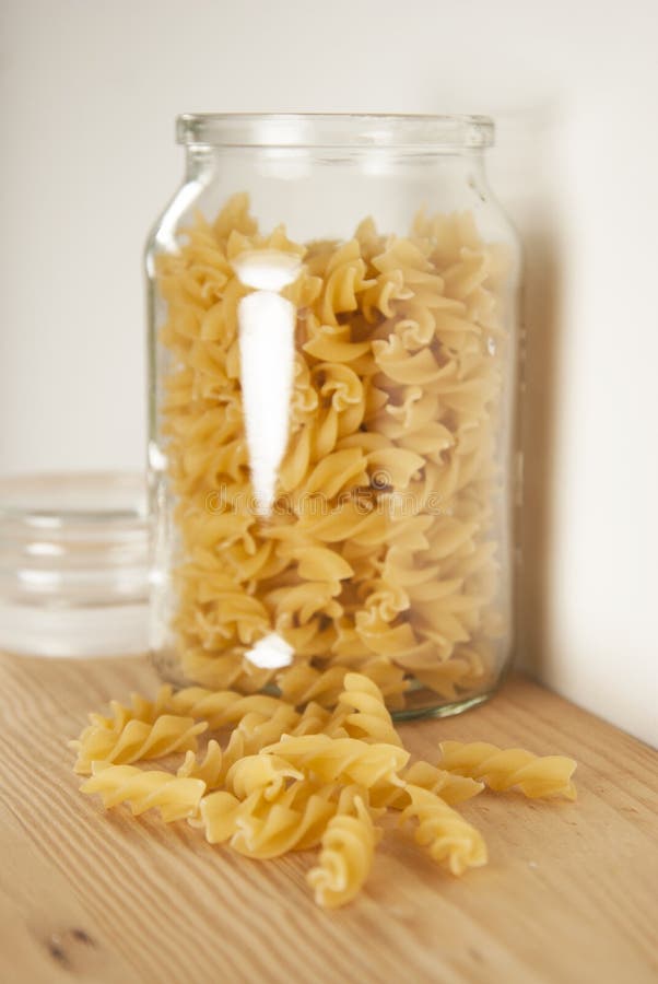 Pasta in Glass Pot or Jar Isolated on White Background. Cooking Time