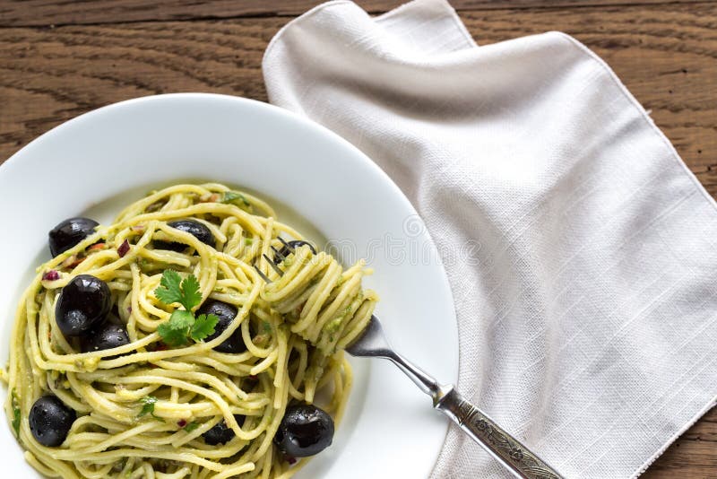 Pasta with Guacamole Sauce and Black Olives Stock Photo Image of