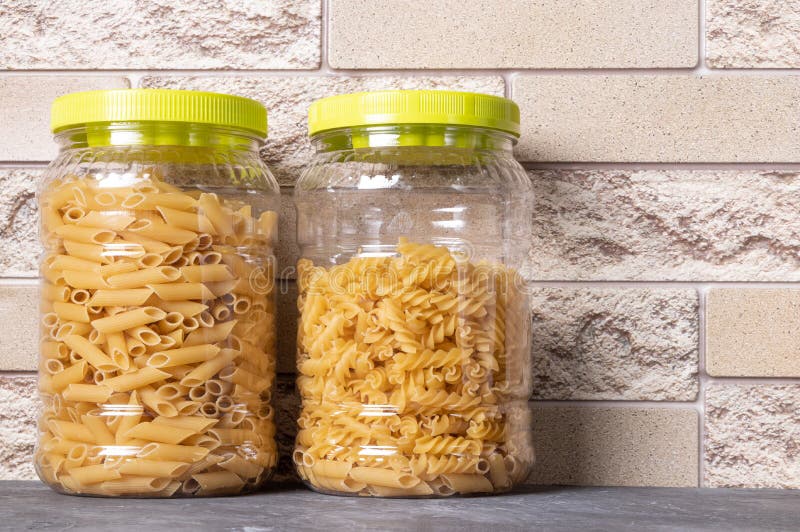 Pasta in Large Plastic Jars on the Kitchen Table. Italian Food Stock Photo Image of organic