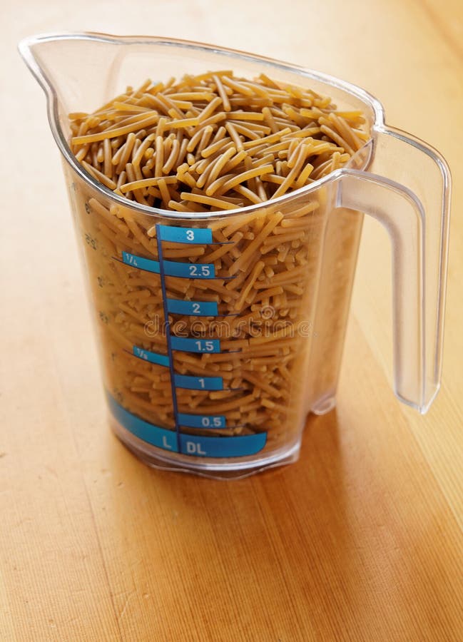 Pasta in Measuring Cup stock image. Image of wooden, liter - 24865743