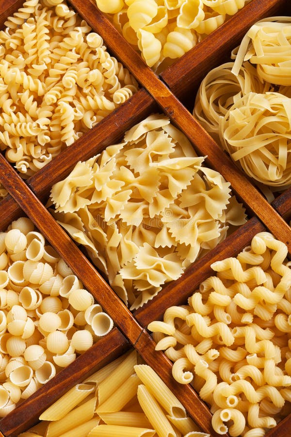 Pasta mix in compartment wooden box royalty free stock photos Pasta mix in compartment wooden box royalty free stock photos
